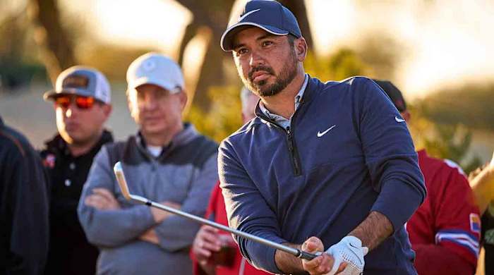 Jason Day watches a shot at the 2023 WM Phoenix Open.